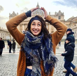 Person posing outside the Vatican.